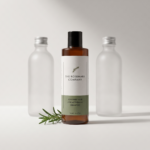 Rosemary Hair Strengthening Shampoo standing out in front of two unbranded shampoo bottles, with fresh rosemary on a sage background.